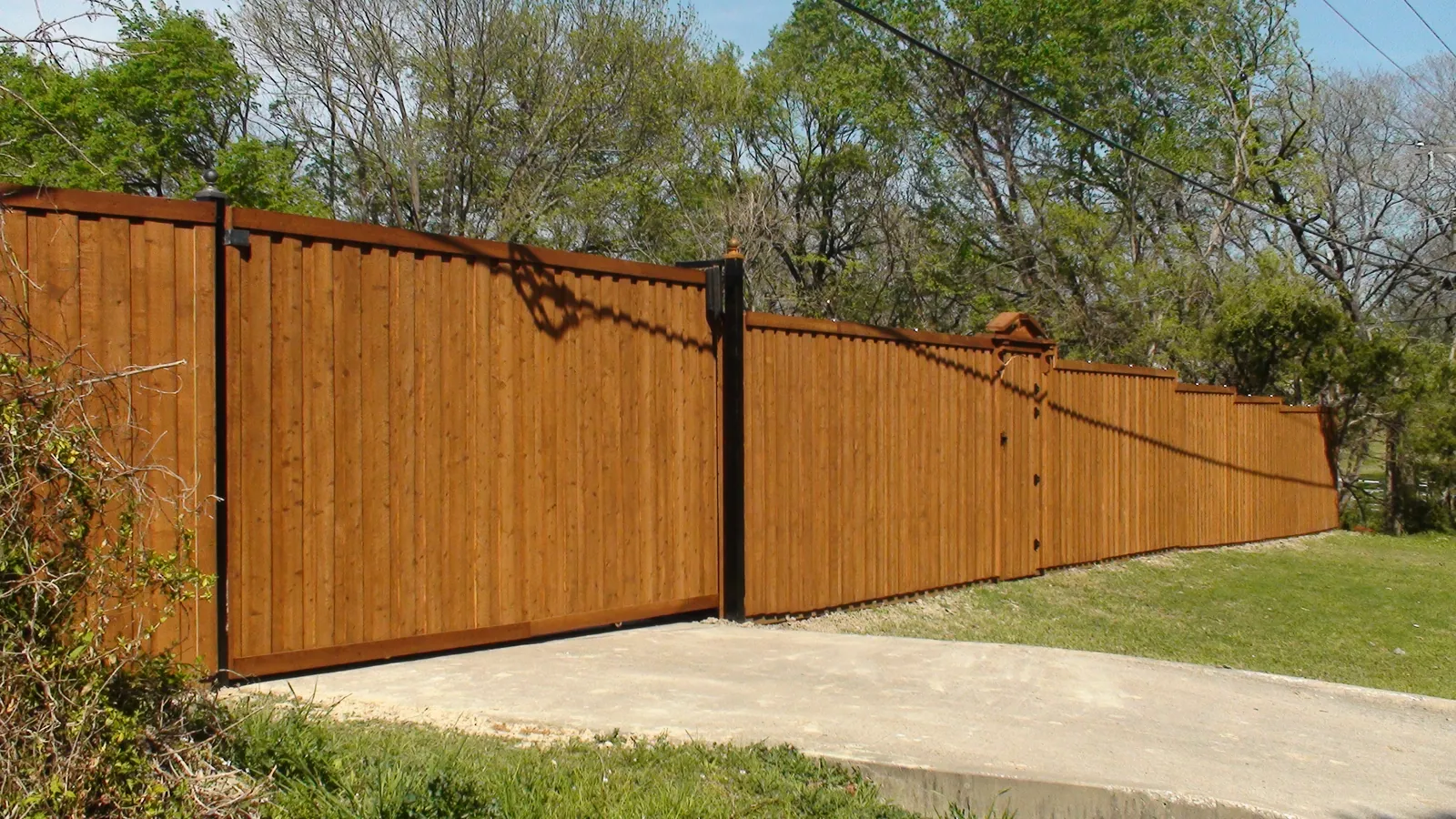 Electric gate board on board fence gate with pediment top — Fence Max Texas project