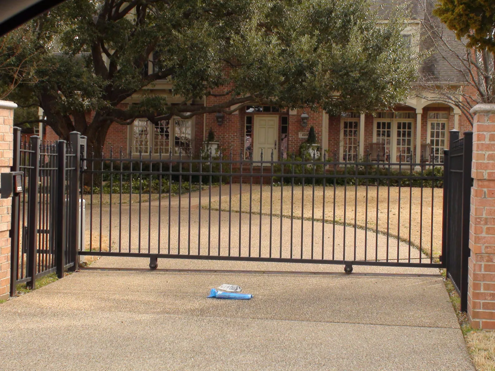Iron slide gate extended pickets with finials — Fence Max Texas project