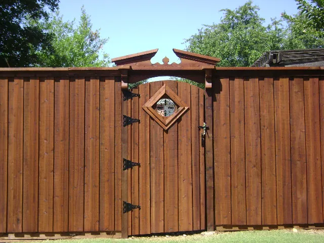 Board on board fence with pediment corbels insert