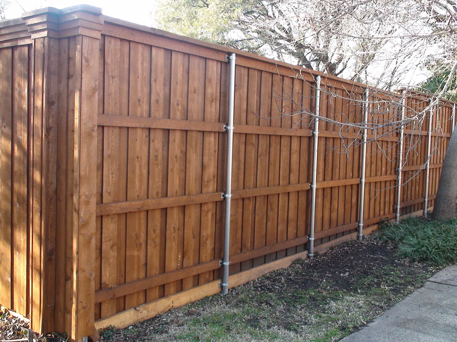Board on board fence triple trim back view