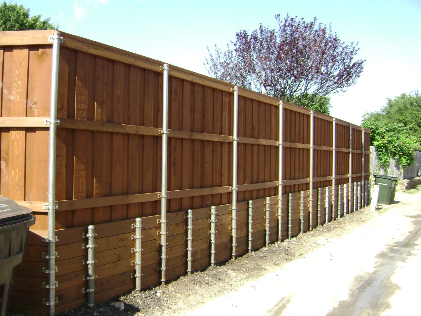 Fence with retaining wall short post — Fence Max Texas project