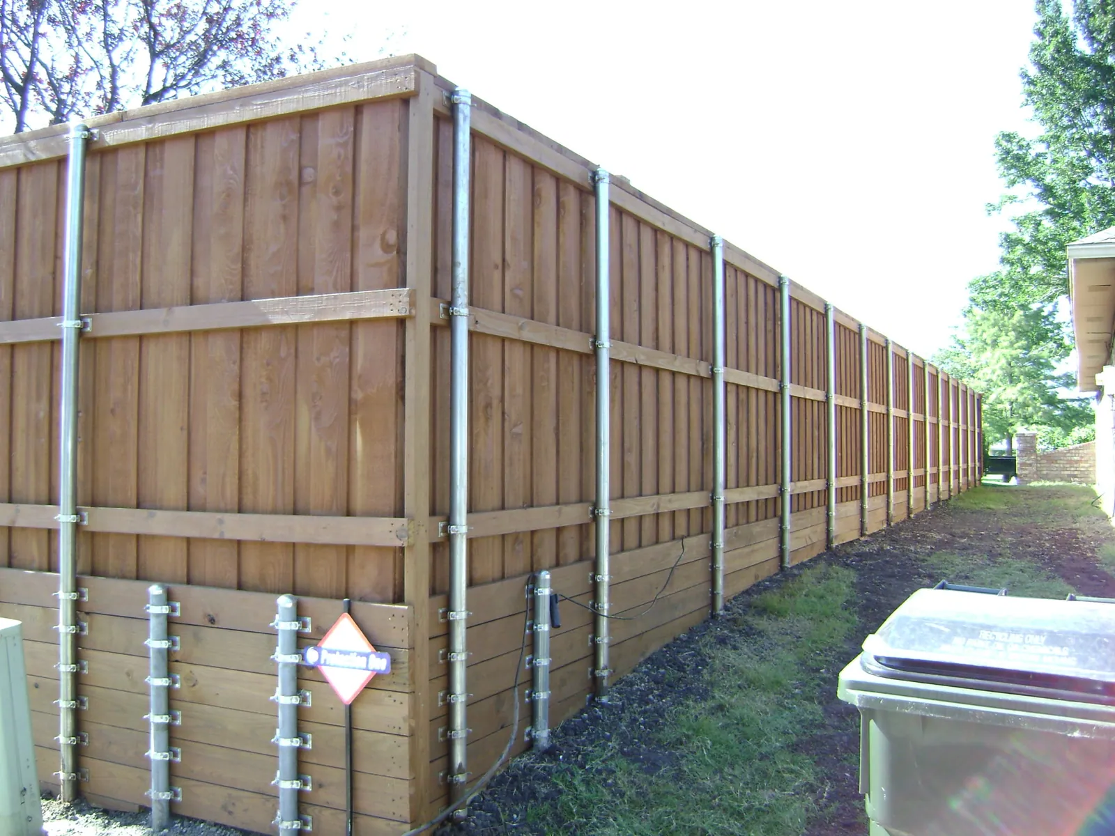 Fence retaining wall short post — Fence Max Texas project