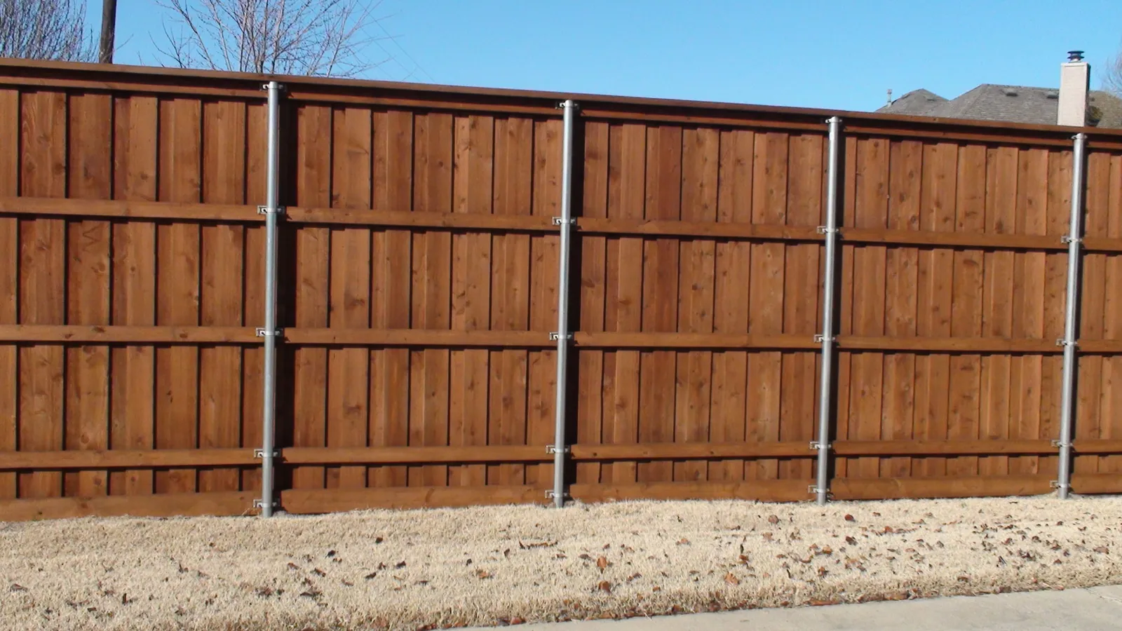 Board on board fence metal post view — Fence Max Texas project